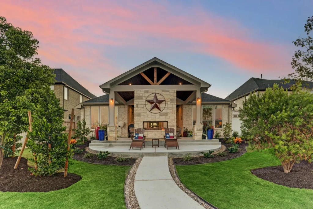 Outdoor patio with fireplace in Cane Island, Katy